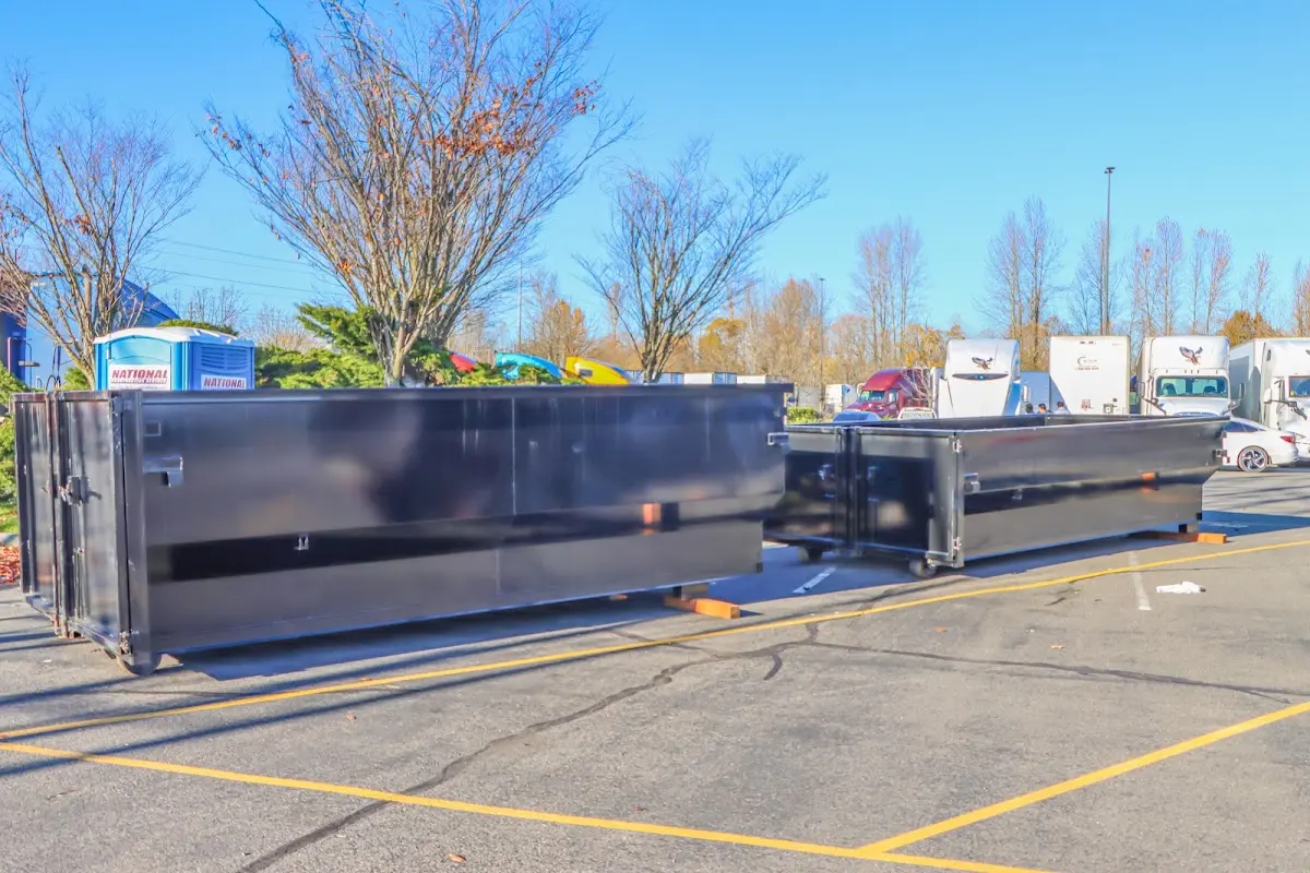 Professional dumpster rental service with roll-off container on residential driveway in Rincon Valley